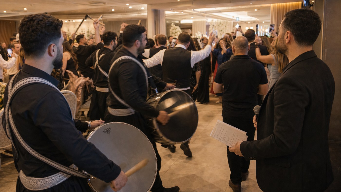 Lebanese zaffe entrance with drummers, guests, and MC adjusting to the crowd energy