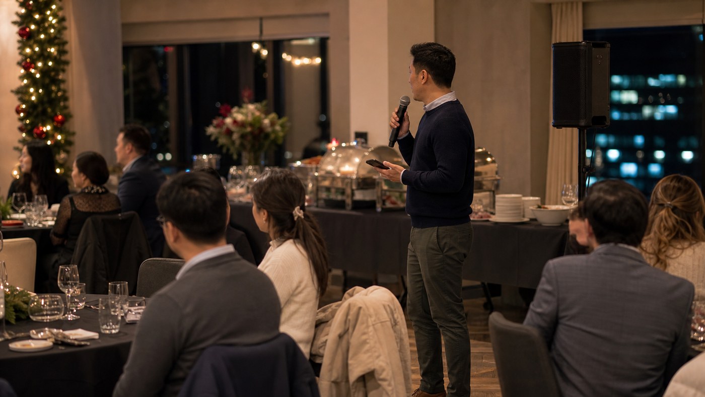 Office worker unexpectedly MCing a Sydney Christmas in July party beside a buffet
